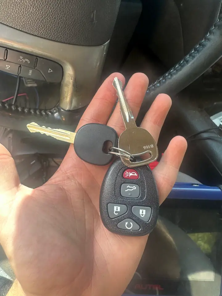 Car key and remote fob in hand — Kwikey Locksmith work in Delaware